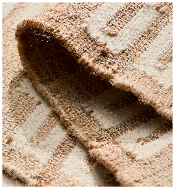 Close-up of jute rug with a checkered pattern.